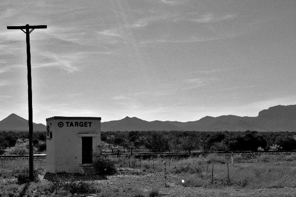 A small concrete building in the desert with the Target logo